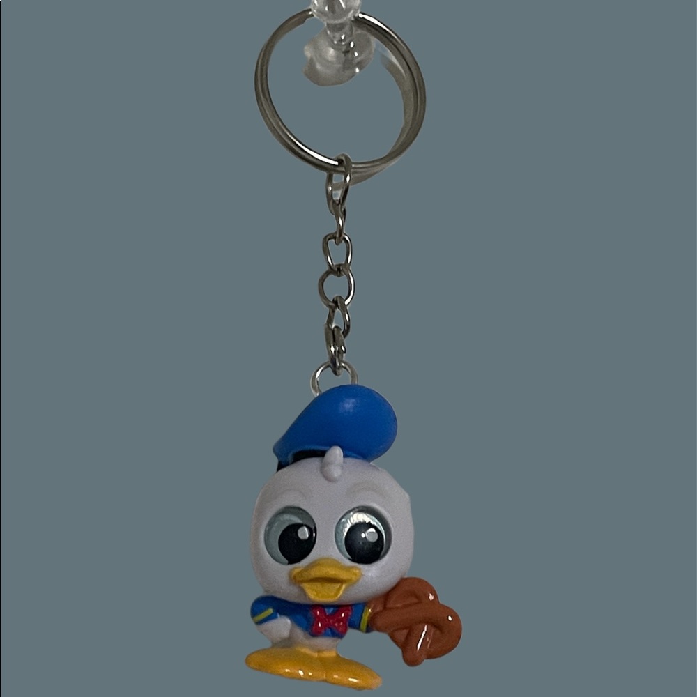 Disney donald duck holding a pretzel key chain